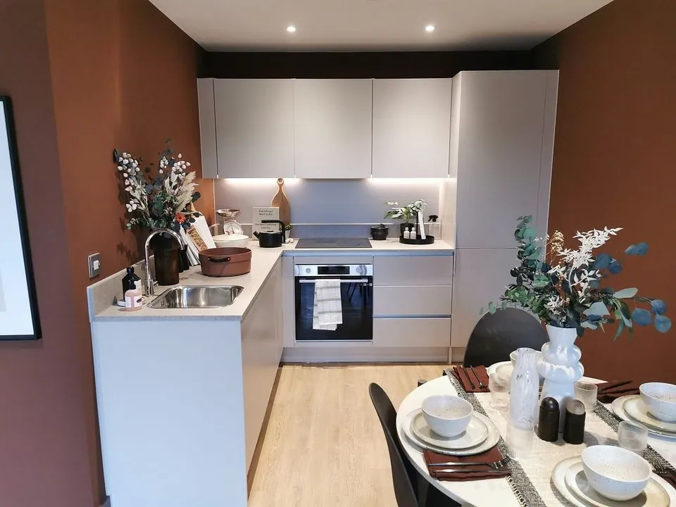 Fitted apartment kitchen with dining area